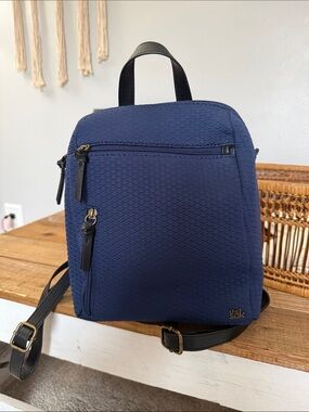 The Sak Navy Textured Backpack with Black Accents